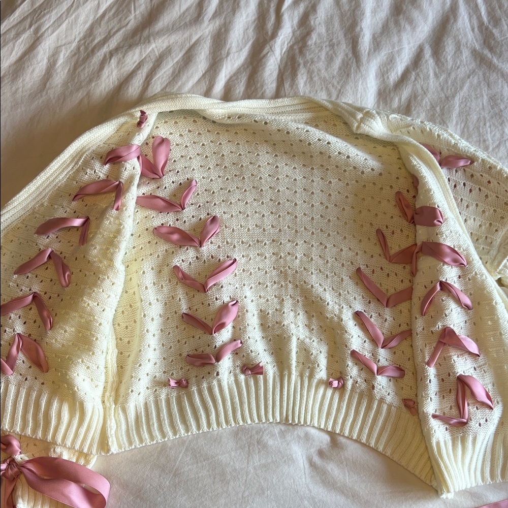 Elegant Cream Cardigan with Pink Ribbon Accents - Picture 8 of 9